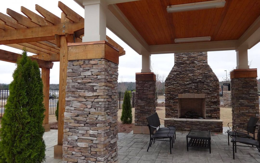 outdoor fireplace with stone veneer