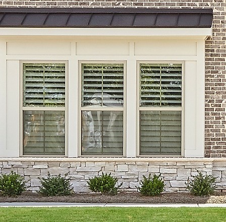 Stone veneer skirt with brick home exterior