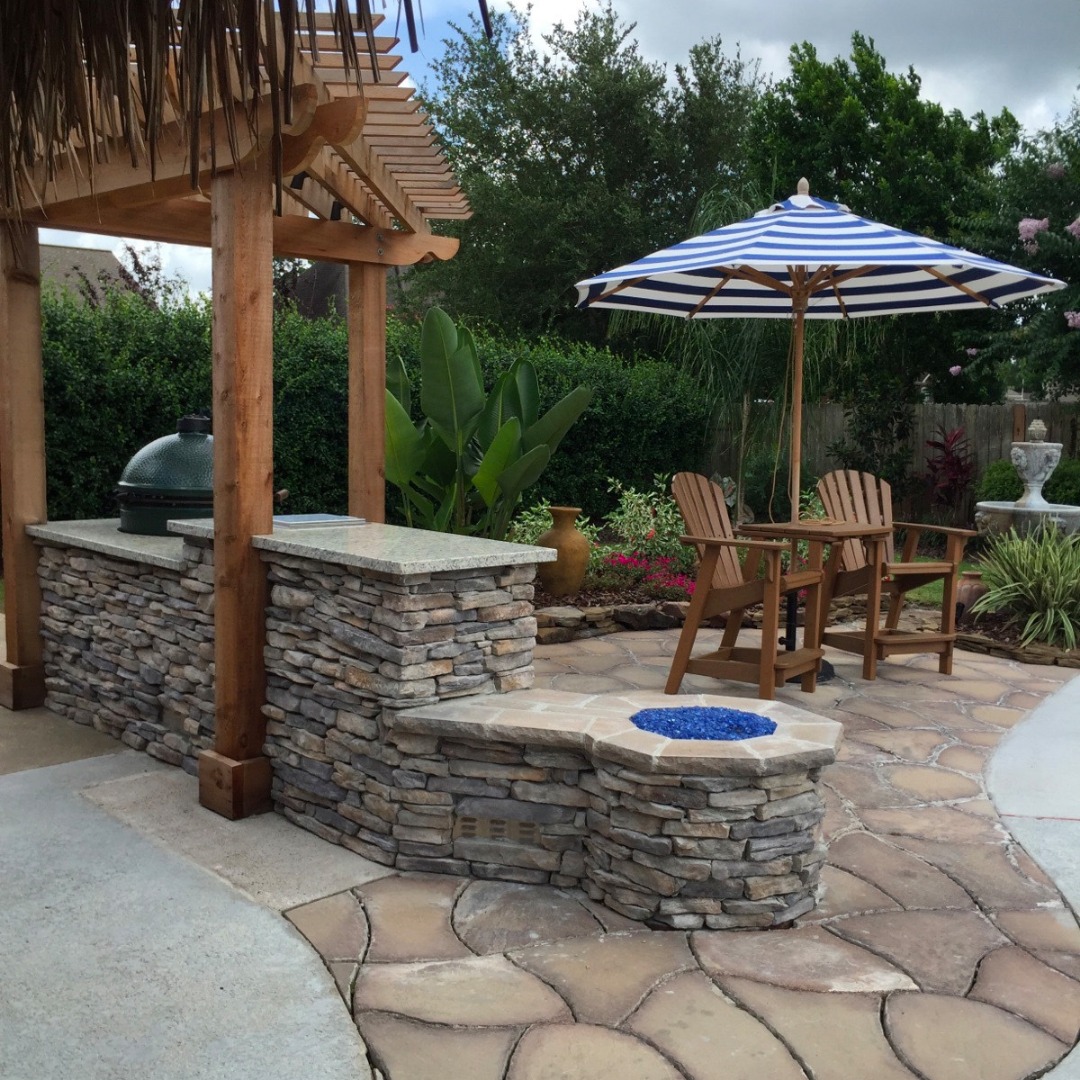 outdoor stone fireplace poolside