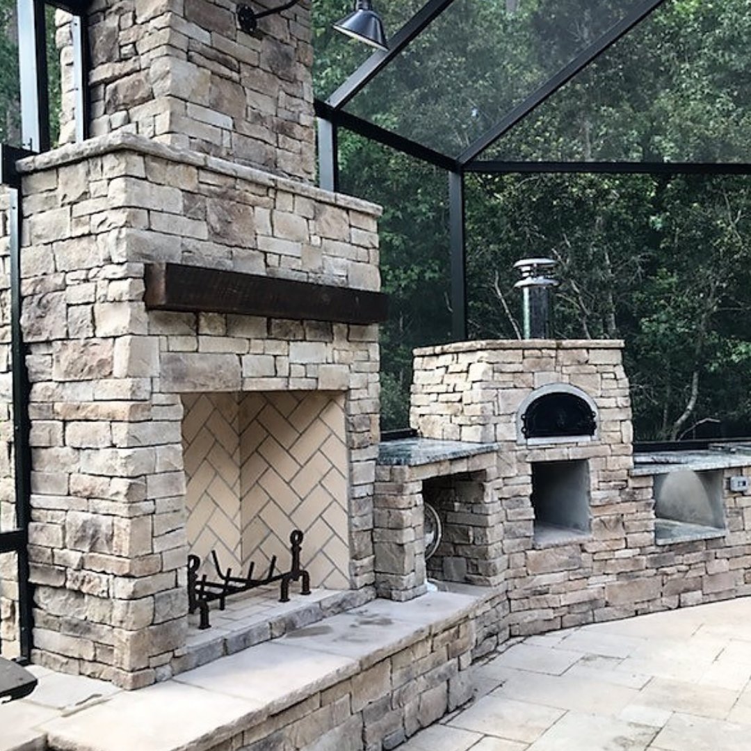 outdoor stone fireplace poolside