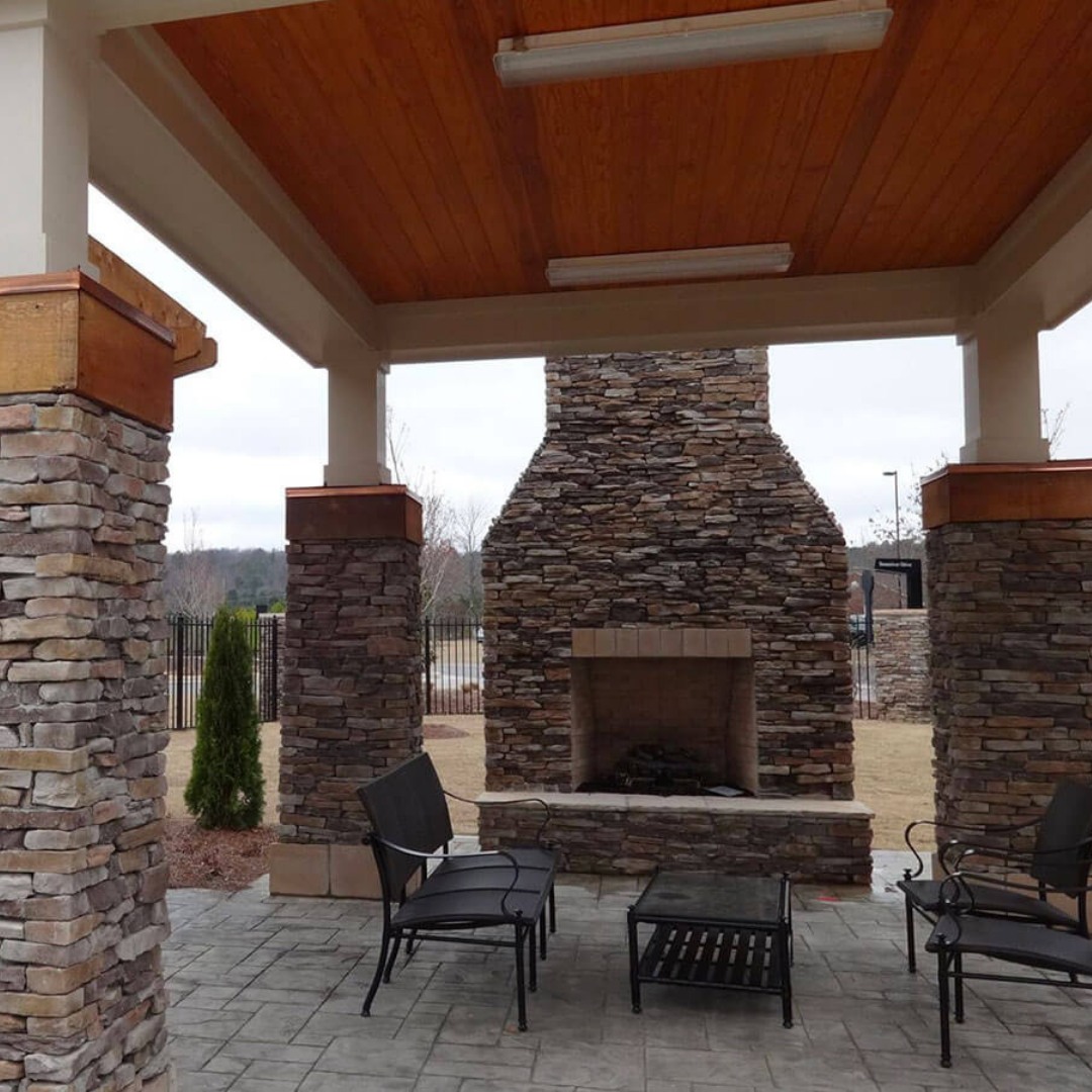 outdoor stone fireplace and columns