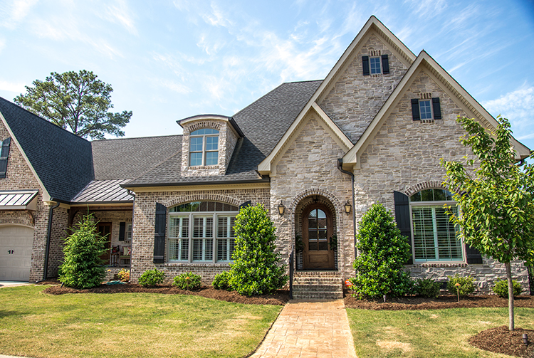  Tudor style home with handcrafted stone and brick front | Horizon Stone