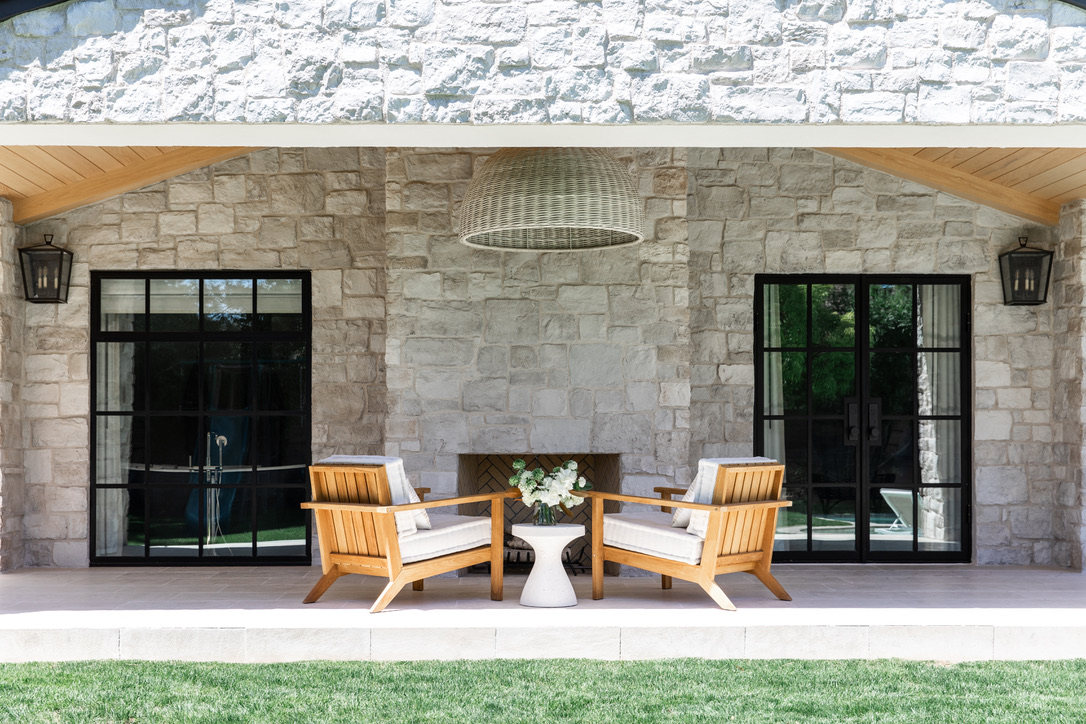 Horizon Stone’s beautiful white 19th Century Hermitage stone outdoor patio with fireplace.