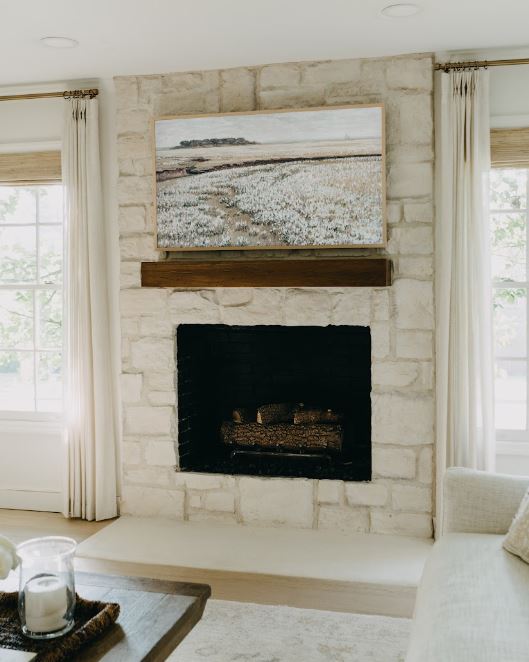  Horizon Stone’s 19th Century Sedona stone fireplace in a modern white farmhouse living room.