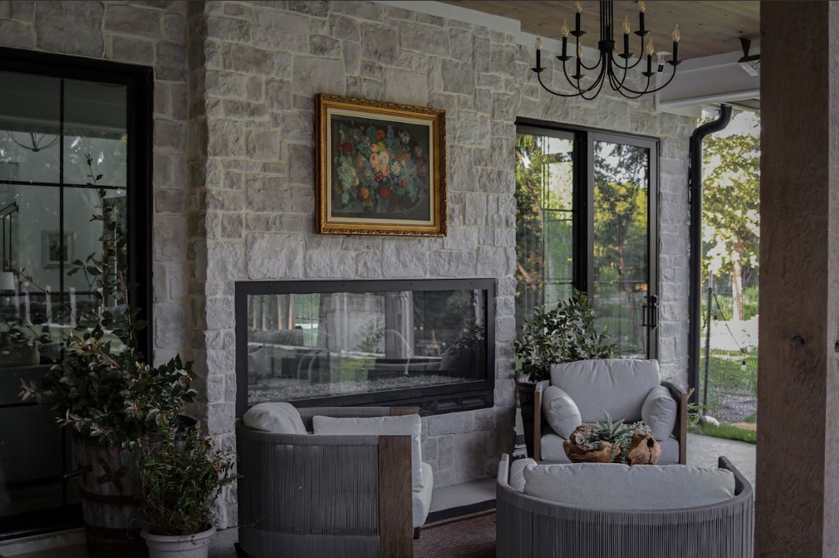 Horizon Stone’s 19th Century Hermitage grey stone creates a beautiful European-inspired hearth for this outdoor patio