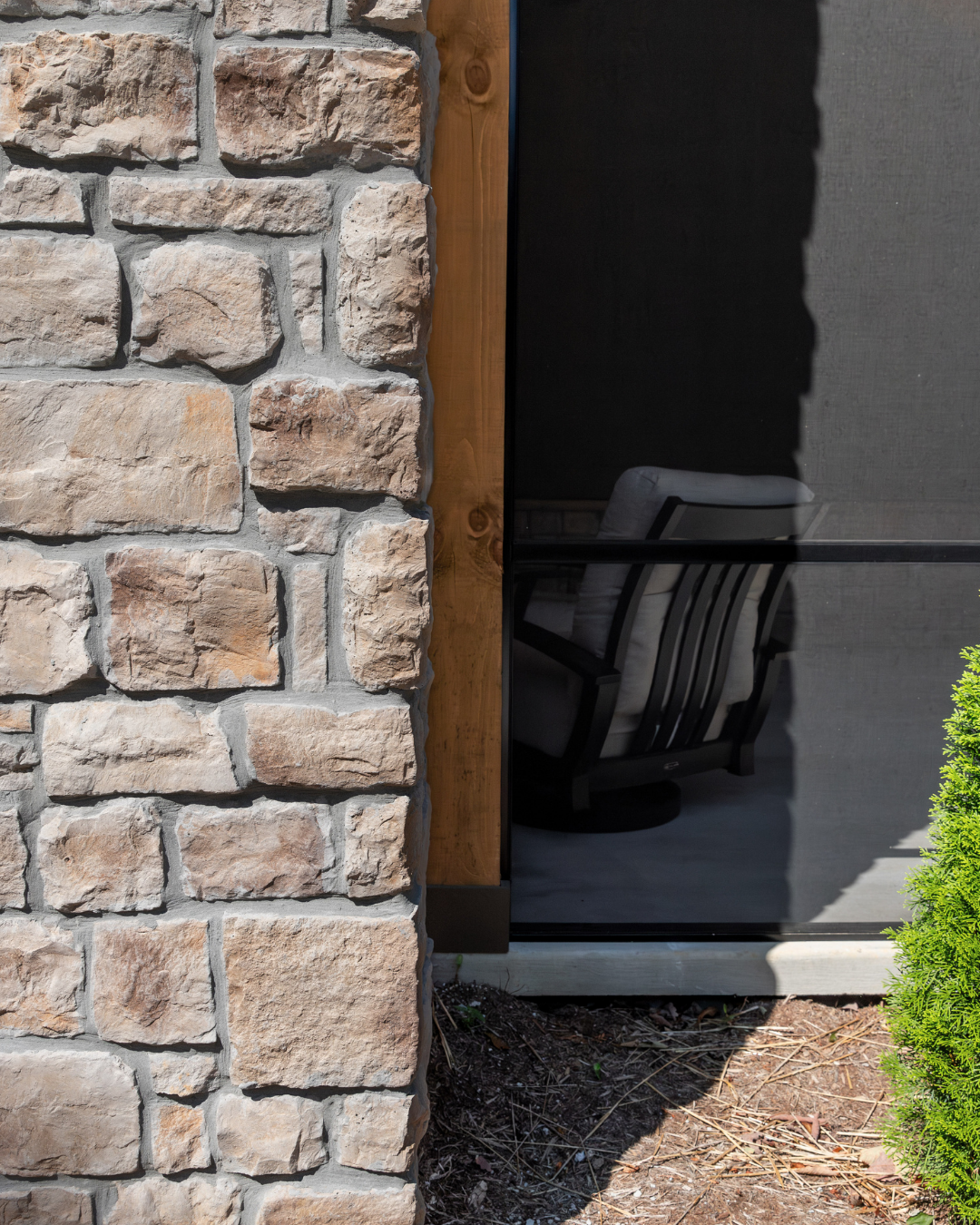 Exterior Home Close up of porch entryway, stone veneer siding in beige brown tones