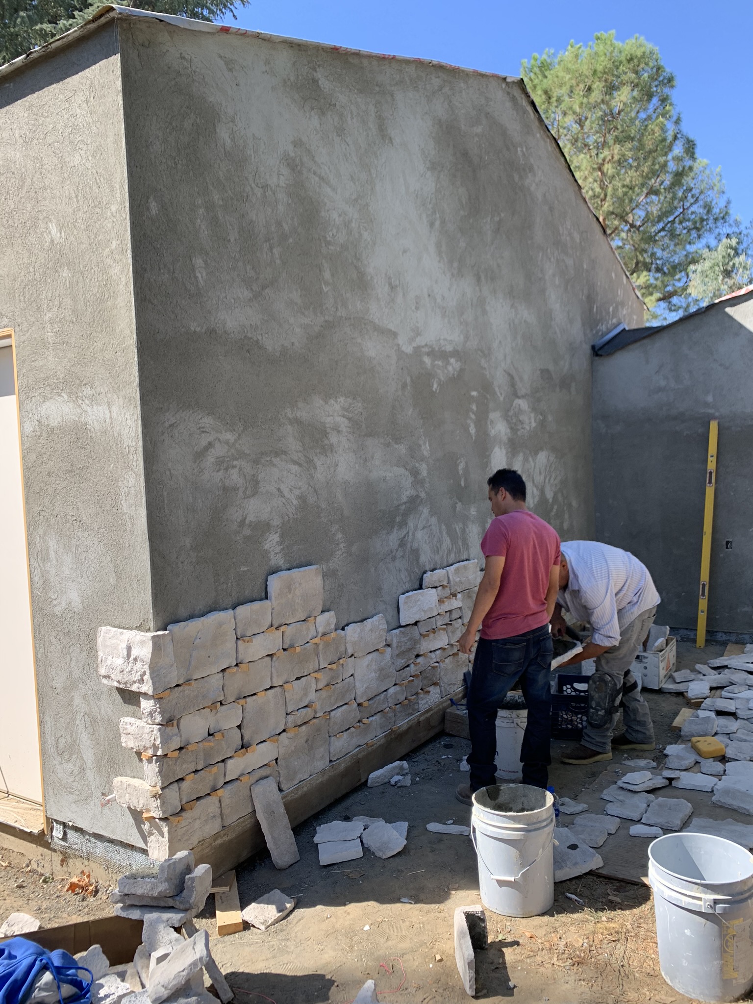 Stone veneer installation in progress